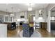 Eat-in kitchen featuring modern appliances, tile backsplash, and a cozy dining area at 13 Ridgeline Dr, Brownsburg, IN 46112