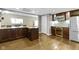 Well-equipped kitchenette with stainless appliances, a wine fridge, and stylish cabinets at 13 Ridgeline Dr, Brownsburg, IN 46112