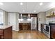 Kitchenette area boasting stainless appliances, custom cabinetry, and a convenient wine refrigerator at 13 Ridgeline Dr, Brownsburg, IN 46112