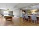 Basement area featuring a kitchenette, pool table, and island with bar seating at 13 Ridgeline Dr, Brownsburg, IN 46112