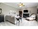 Comfortable living room featuring a fireplace, ceiling fan, and plush seating at 13 Ridgeline Dr, Brownsburg, IN 46112