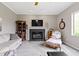 Inviting living room with a fireplace, ceiling fan, and comfortable seating at 13 Ridgeline Dr, Brownsburg, IN 46112
