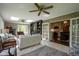 Sunlit living room with fireplace, skylights, open layout to the kitchen, and comfortable seating at 13 Ridgeline Dr, Brownsburg, IN 46112