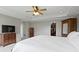 A shot of a main bedroom featuring carpet, walk-in closet, tray ceiling, TV, and wood furniture at 13 Ridgeline Dr, Brownsburg, IN 46112