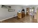 Spacious home office with hardwood floors, natural light, and wooden desk and storage cabinets at 13 Ridgeline Dr, Brownsburg, IN 46112