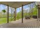 Covered porch includes outdoor furniture and a peaceful view of the green backyard at 13 Ridgeline Dr, Brownsburg, IN 46112