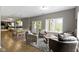Recreation room features a pool table, a lounge area, hardwood floors, and plenty of light at 13 Ridgeline Dr, Brownsburg, IN 46112