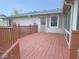 Large back deck with wooden railings adjoins the house and the backyard at 1314 Brookside S Dr, Columbus, IN 47201