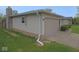 Home's exterior boasts a well-maintained lawn and a convenient attached two car garage at 1314 Brookside S Dr, Columbus, IN 47201