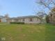 Charming single-story home with manicured lawn, mature hedges, and an attached garage at 1314 Brookside S Dr, Columbus, IN 47201