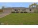 Charming ranch-style home with a well-maintained lawn and an attached garage at 1314 Brookside S Dr, Columbus, IN 47201
