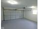The spacious garage features an automatic door opener and access to natural light at 1314 Brookside S Dr, Columbus, IN 47201
