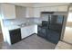 Updated kitchen with white cabinets, modern appliances, and granite countertops at 1314 Brookside S Dr, Columbus, IN 47201