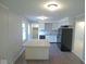 Spacious kitchen featuring an island, white cabinets, and sleek appliances at 1314 Brookside S Dr, Columbus, IN 47201