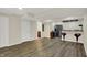 Finished basement features a bar with modern appliances and wood flooring at 13728 Oliver Ln, Carmel, IN 46074