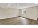 Basement bonus room featuring wood flooring and a large window at 13728 Oliver Ln, Carmel, IN 46074