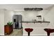 Finished basement bar area with stainless steel refrigerator and wine storage at 13728 Oliver Ln, Carmel, IN 46074
