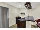Finished basement bar area with black countertops, wine rack and refrigerator at 13728 Oliver Ln, Carmel, IN 46074