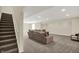A finished basement featuring recessed lighting, comfortable seating, and easy access to the upper levels at 13728 Oliver Ln, Carmel, IN 46074