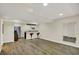 Spacious finished basement with wood-look floors and a modern bar area, perfect for entertaining at 13728 Oliver Ln, Carmel, IN 46074