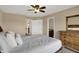 Bedroom with neutral walls and carpet plus large dresser and entry to bathroom at 13728 Oliver Ln, Carmel, IN 46074