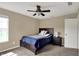 Bedroom with neutral walls and carpet plus ceiling fan and bright window at 13728 Oliver Ln, Carmel, IN 46074