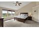 Bedroom with vaulted ceiling, bright windows, and a large dresser plus neutral walls at 13728 Oliver Ln, Carmel, IN 46074