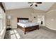 Bedroom with vaulted ceiling, bright windows, neutral walls, and large carpet at 13728 Oliver Ln, Carmel, IN 46074
