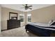 Bedroom with bright windows, neutral walls, and dresser with large mirror at 13728 Oliver Ln, Carmel, IN 46074