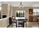 Inviting dining room with a view to the deck and the backyard, complemented by a modern light fixture at 13728 Oliver Ln, Carmel, IN 46074