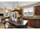 Bright kitchen with granite countertops, stainless steel appliances, and tile backsplash at 13728 Oliver Ln, Carmel, IN 46074