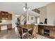 Open-concept kitchen seamlessly connects to the dining area and staircase at 13728 Oliver Ln, Carmel, IN 46074