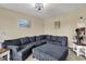 Cozy living room featuring a plush sectional sofa, ottoman, and neutral decor creating a relaxing atmosphere at 13728 Oliver Ln, Carmel, IN 46074