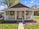 Inviting single-story home with a cute front porch and well-maintained exterior at 1401 E 24Th St, Muncie, IN 47302