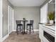 Kitchen with room for seating area; features hardwood flooring, paint, trim, and lighting at 1401 E 24Th St, Muncie, IN 47302