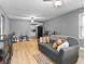 Open-concept living room featuring neutral walls and wood-look flooring at 1401 E 24Th St, Muncie, IN 47302