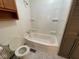 Clean bathroom features a shower-tub combination, and essential fixtures at 1401 W 34Th St, Indianapolis, IN 46208