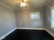 Clean bedroom with neutral paint, hardwood floor, and bright natural light at 1401 W 34Th St, Indianapolis, IN 46208