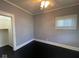 Clean bedroom with dark hardwood floors, gray walls, and white trim at 1401 W 34Th St, Indianapolis, IN 46208