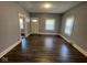 The spacious living room features new flooring, fresh paint, and ample natural light at 1401 W 34Th St, Indianapolis, IN 46208