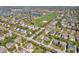 An expansive view of a suburban community with many homes and green spaces and ballfields at 15329 Smithfield Dr, Westfield, IN 46074