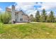This house has a large, lush backyard with mature trees, perfect for entertaining at 15329 Smithfield Dr, Westfield, IN 46074