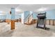 Unfinished basement featuring a treadmill and stairs to the main level, concrete floor at 15329 Smithfield Dr, Westfield, IN 46074