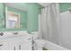 Bathroom featuring a white shower curtain, vanity, toilet and light green walls at 15329 Smithfield Dr, Westfield, IN 46074