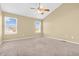 Spacious bedroom featuring neutral carpet, vaulted ceiling with fan and two windows for ample natural light at 15329 Smithfield Dr, Westfield, IN 46074