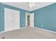 Bedroom featuring neutral carpet, a ceiling fan, closet, and a door to the bathroom at 15329 Smithfield Dr, Westfield, IN 46074