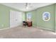 Light and airy bedroom with unique oval window, neutral carpet, and closet at 15329 Smithfield Dr, Westfield, IN 46074