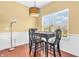 Dining area featuring hardwood floors, a modern light fixture, and a window at 15329 Smithfield Dr, Westfield, IN 46074