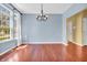 Dining room with hardwood floors, large windows, and a stylish chandelier at 15329 Smithfield Dr, Westfield, IN 46074