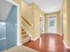 Foyer with hardwood floors, staircase, and view into another room at 15329 Smithfield Dr, Westfield, IN 46074